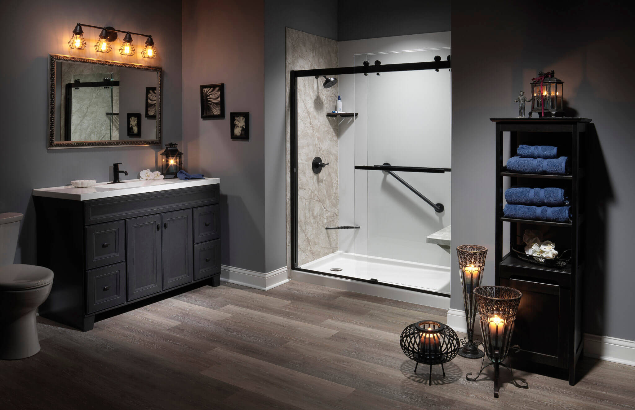 Professional Shower Designers A stylish bathroom with a shower, toilet, and sink, offering a comfortable and convenient space for hygiene.