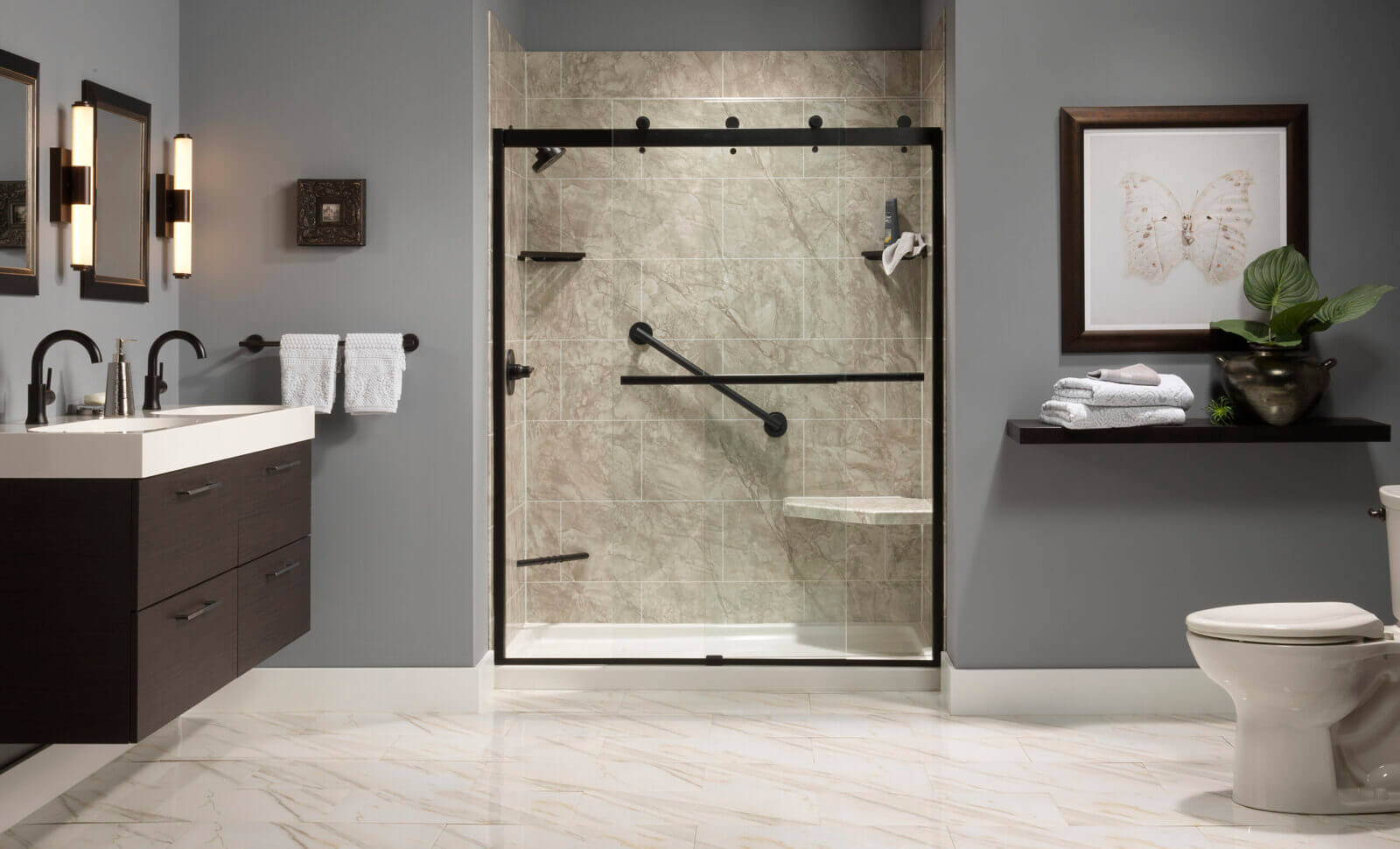 Bathroom Shower Ideas A bathroom featuring a shower, toilet, and sink, with neutral-colored tiles and modern fixtures.