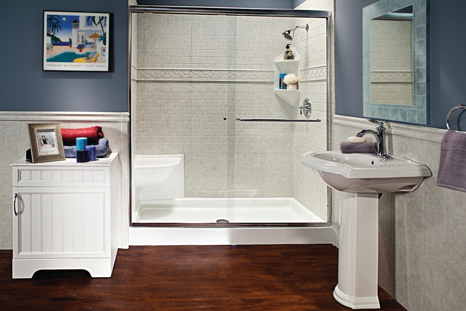 A compact bathroom equipped with a shower, toilet, and sink, highlighting essential amenities for personal care.  