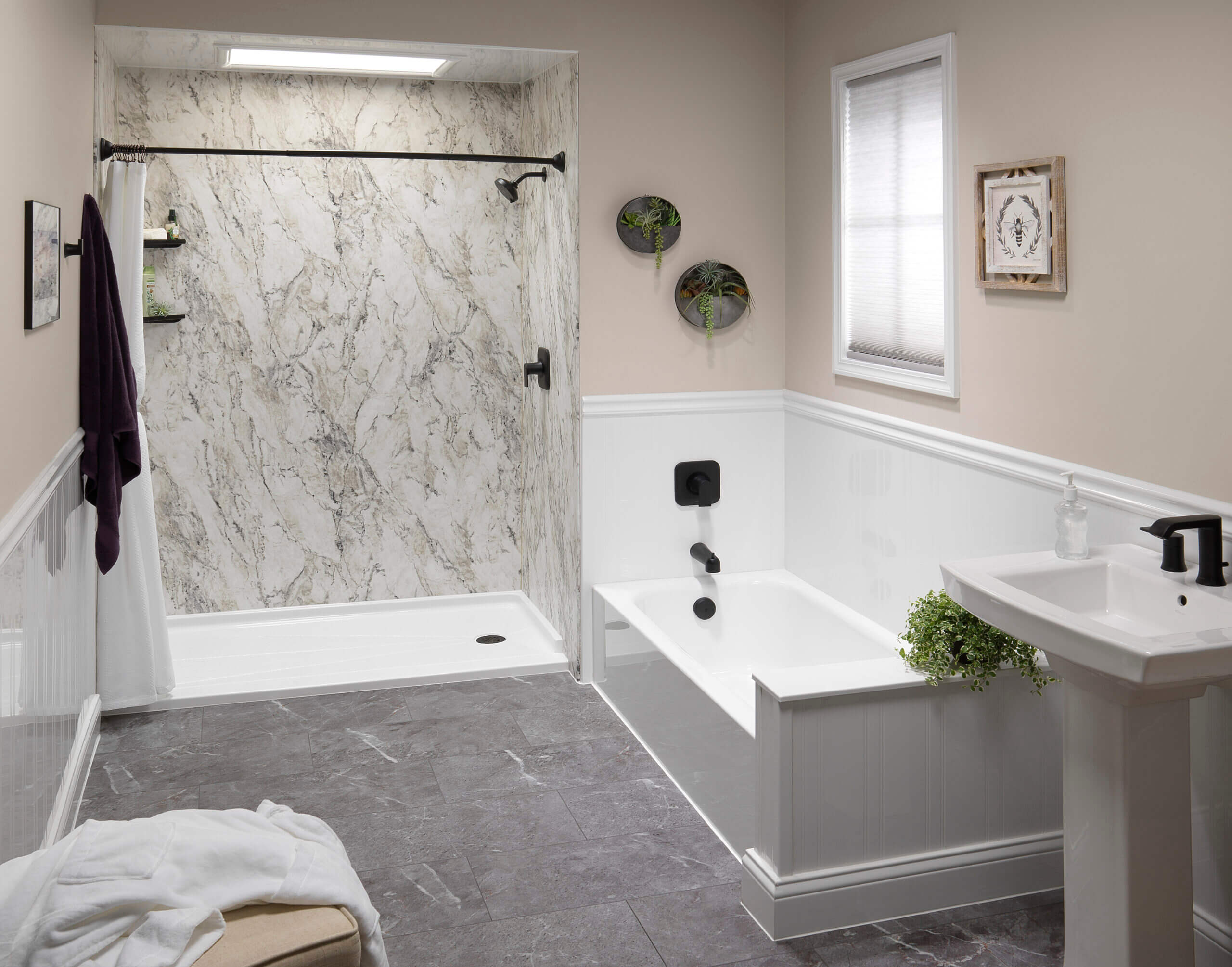 A bathroom featuring a shower, bathtub, and sink, showcasing a clean and modern design. 